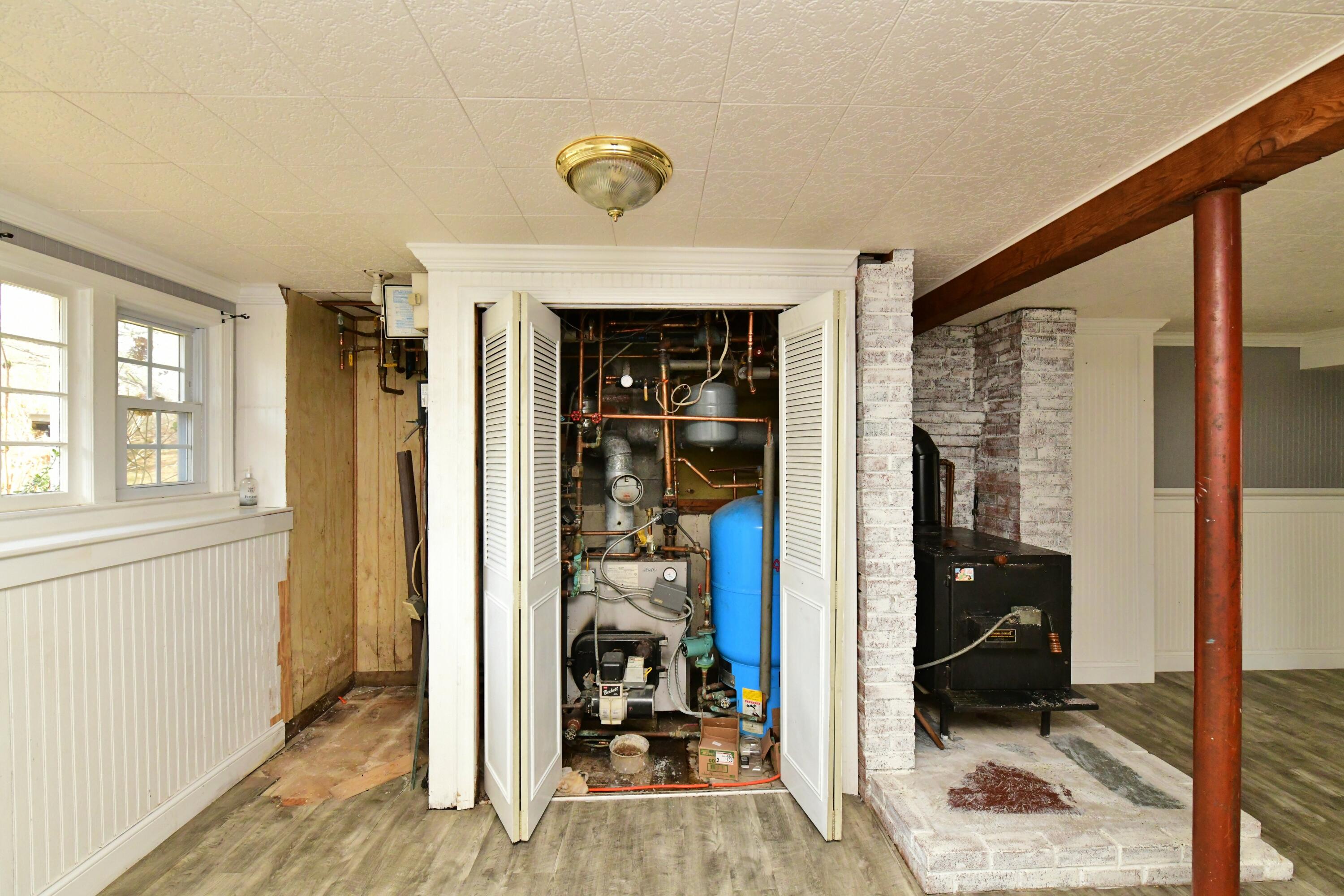 65 Siasconset Drive Sagamore Beach, MA 02562 - Photo 32 of 53 a view of a hallway with bedroom and wooden floor