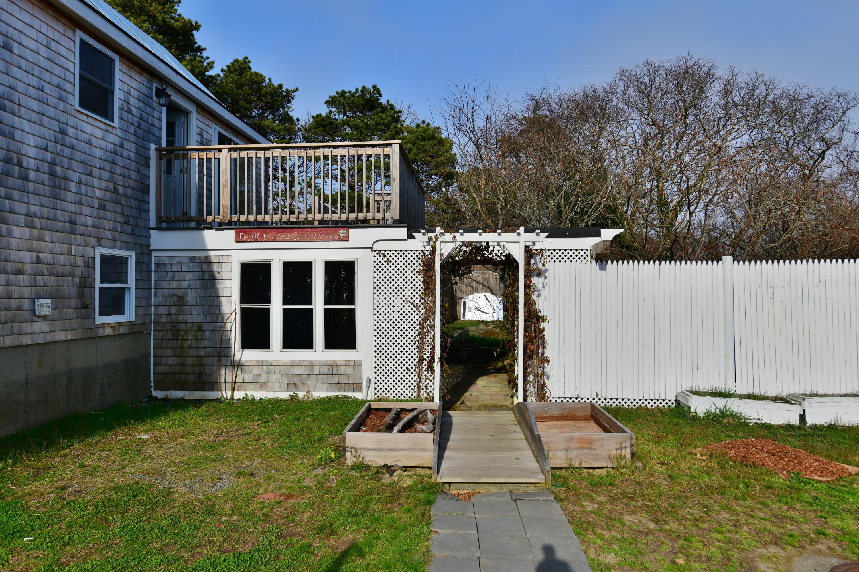 65 Siasconset Drive Sagamore Beach, MA 02562 - Photo 37 of 53 a front view of a house with garden