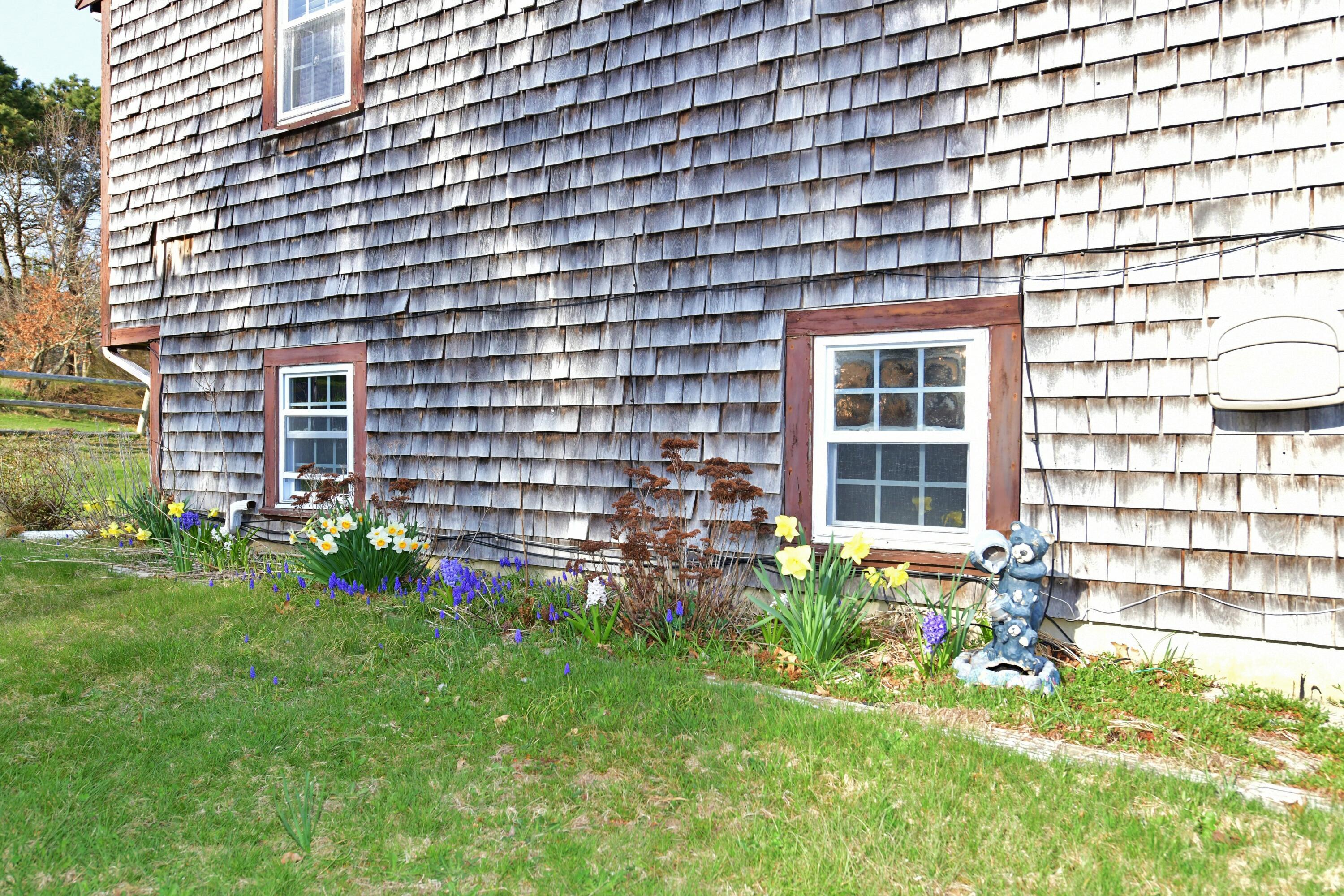 65 Siasconset Drive Sagamore Beach, MA 02562 - Photo 40 of 53 a view of a house with a backyard and sitting area