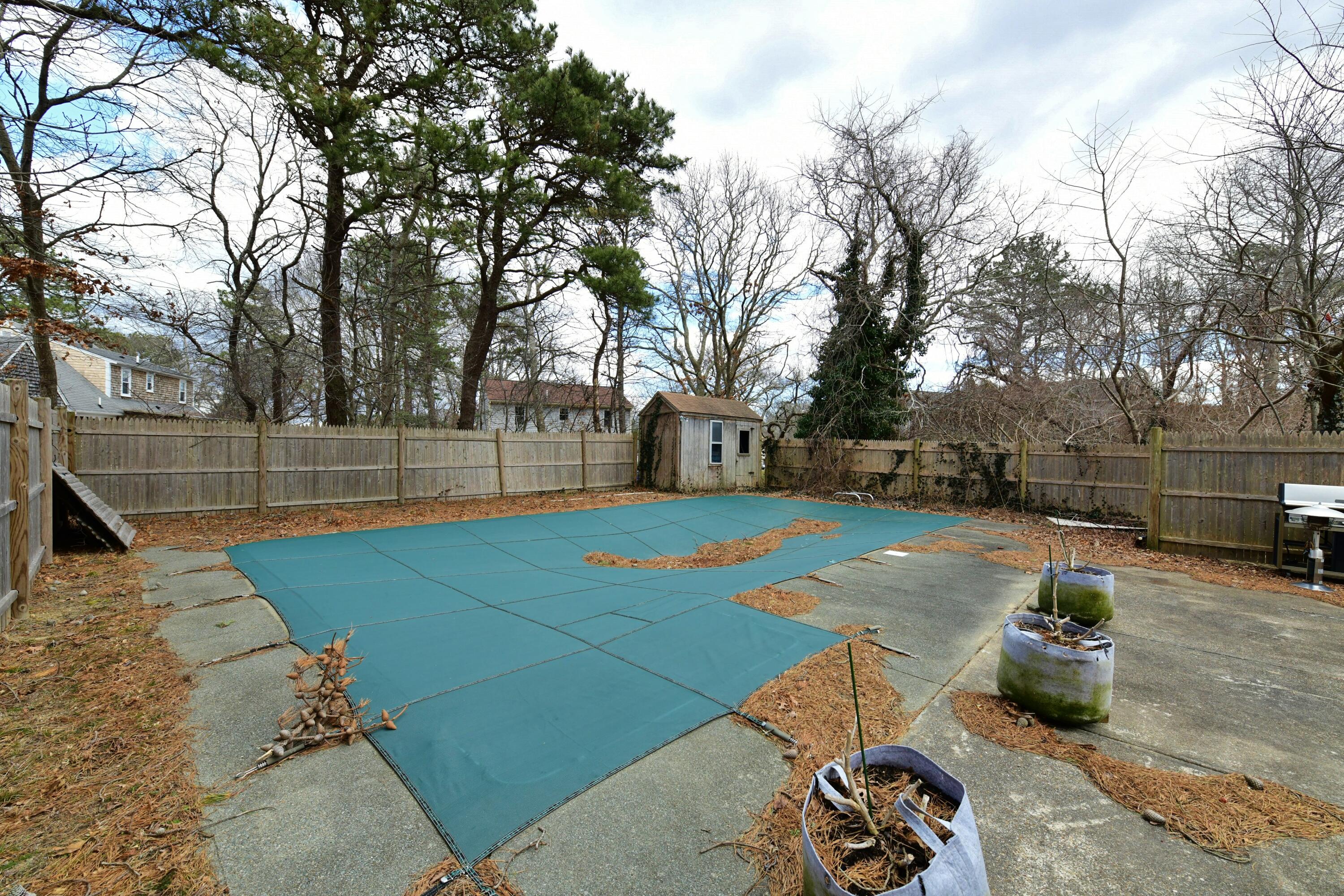 65 Siasconset Drive Sagamore Beach, MA 02562 - Photo 4 of 53 a view of backyard with trampoline