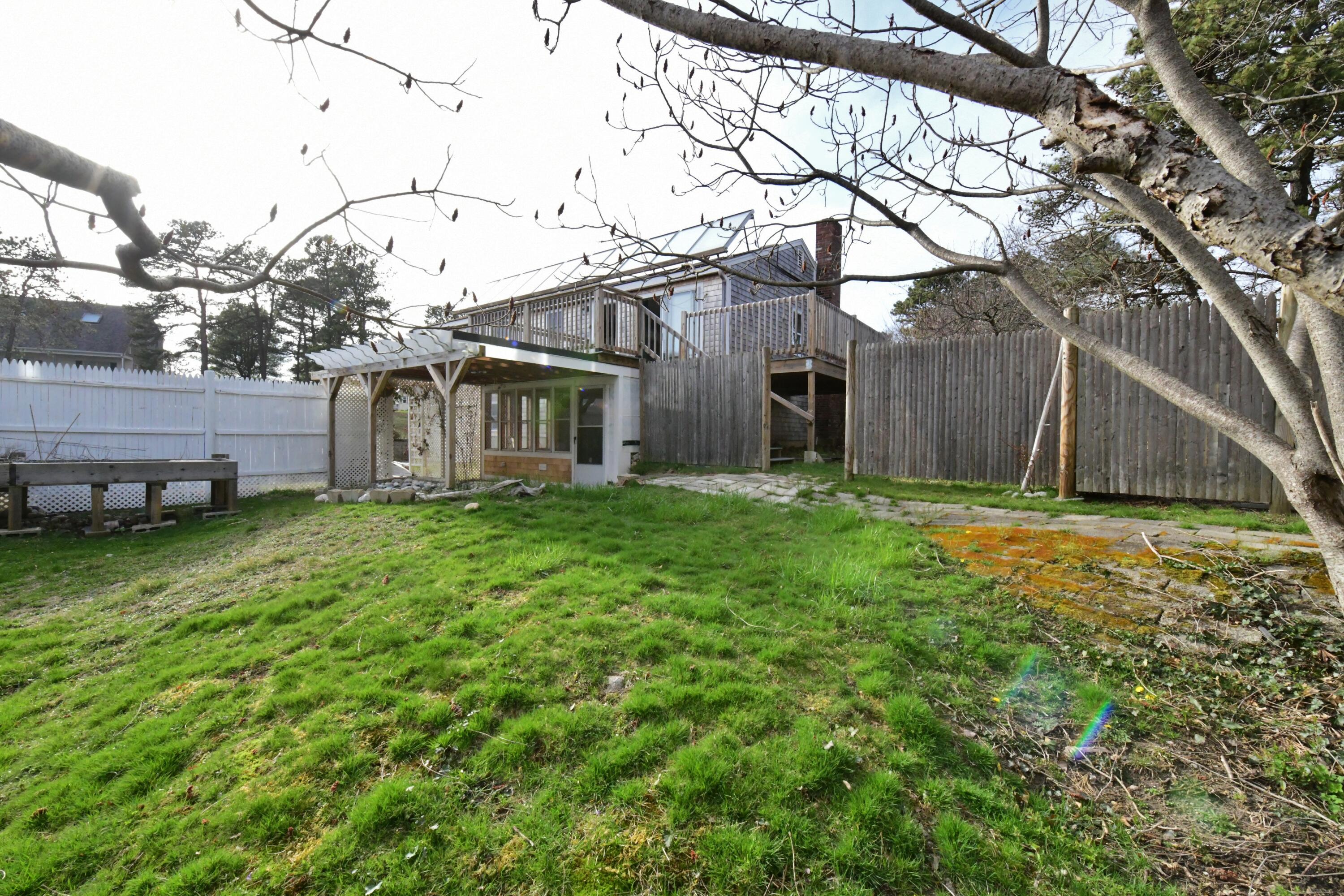 65 Siasconset Drive Sagamore Beach, MA 02562 - Photo 44 of 53 a view of a house with a yard