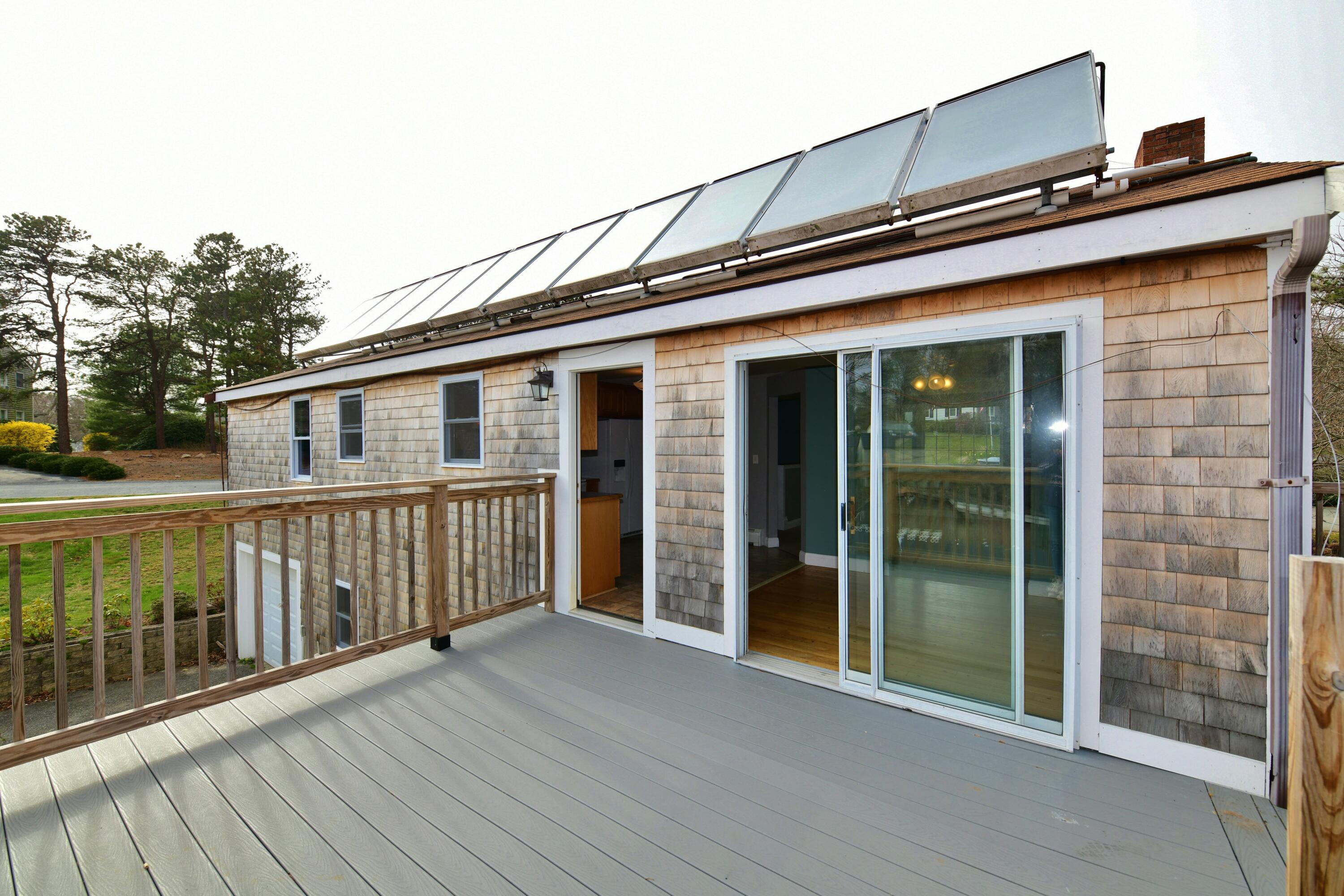 65 Siasconset Drive Sagamore Beach, MA 02562 - Photo 50 of 53 a view of a house with large windows