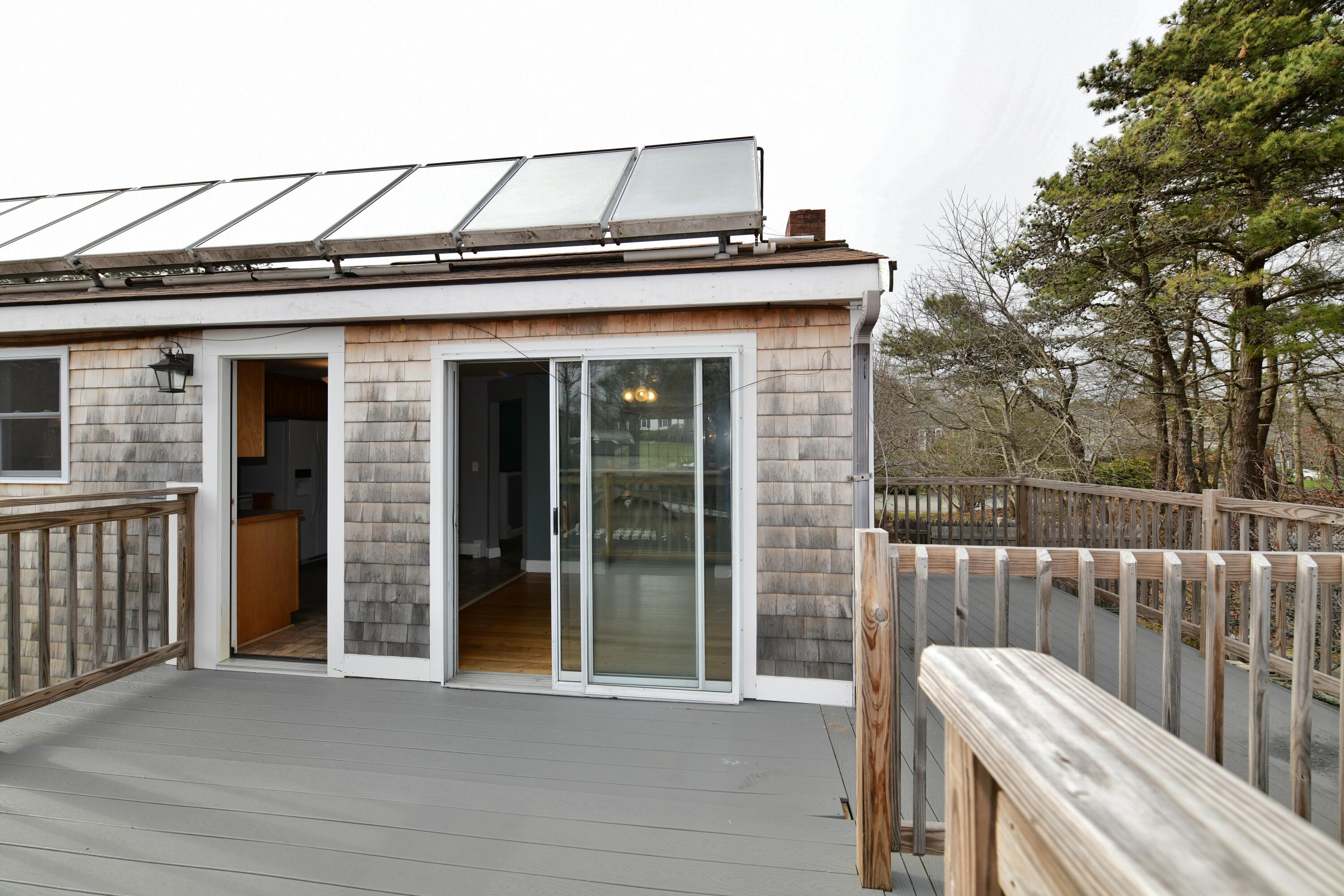 65 Siasconset Drive Sagamore Beach, MA 02562 - Photo 51 of 53 a front view of a house with balcony
