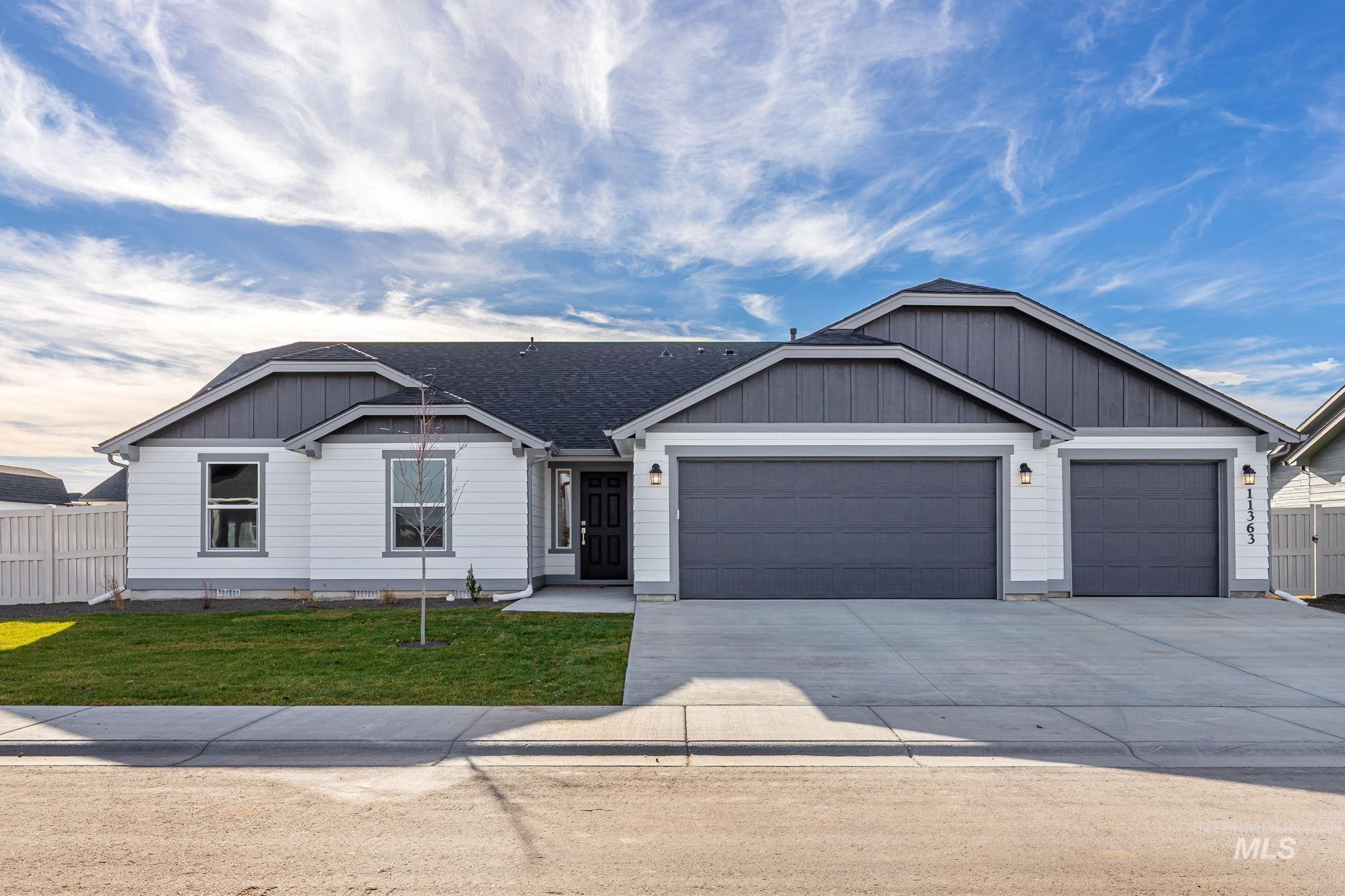 11363 Bluefield Drive Caldwell, ID 83605 - Photo 1 of 35 View of front of house with driveway, a garage, and roof with shingles