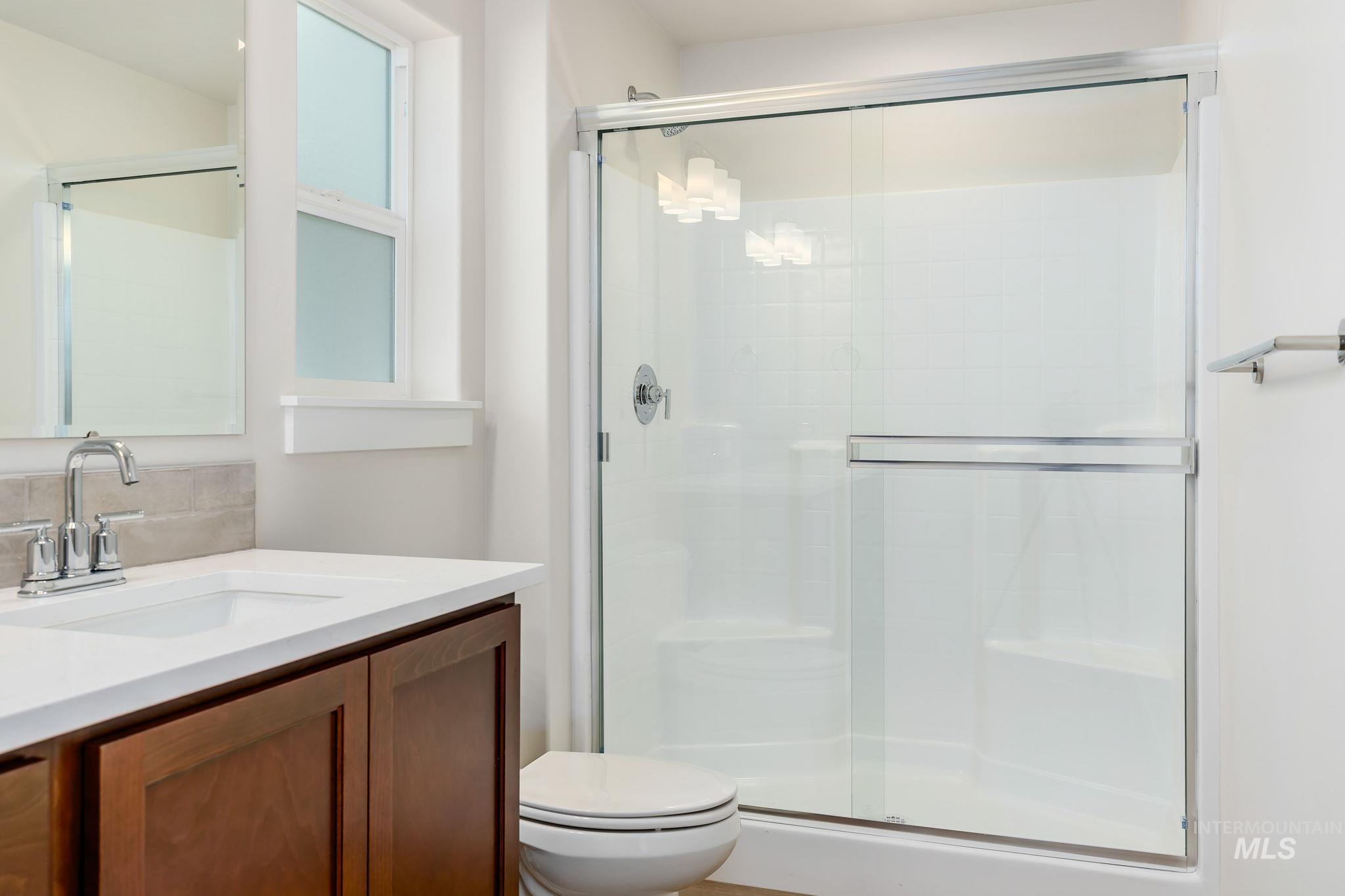 11363 Bluefield Drive Caldwell, ID 83605 - Photo 17 of 35 Bathroom with vanity and a shower stall