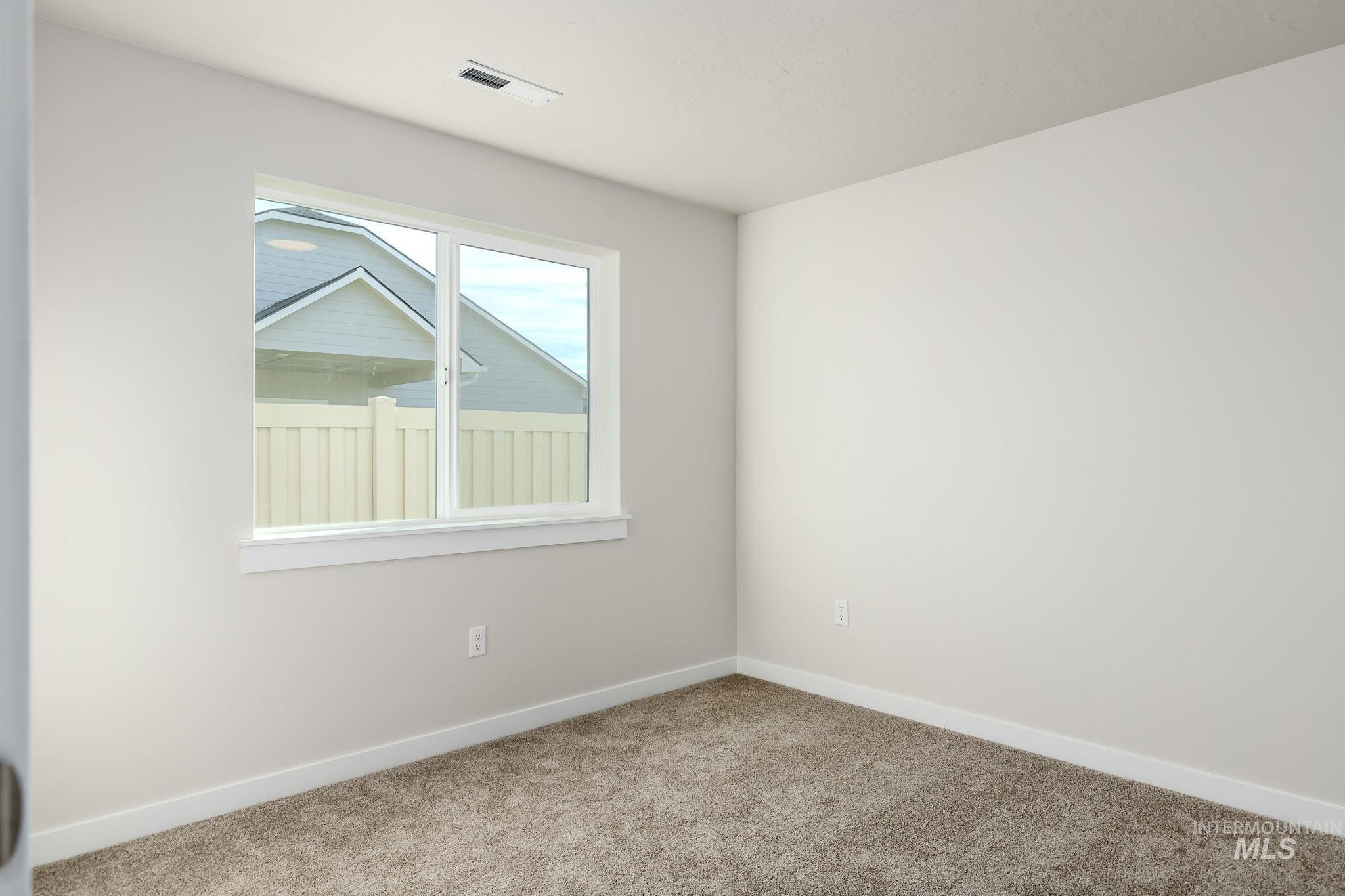 11363 Bluefield Drive Caldwell, ID 83605 - Photo 19 of 35 Carpeted empty room with baseboards