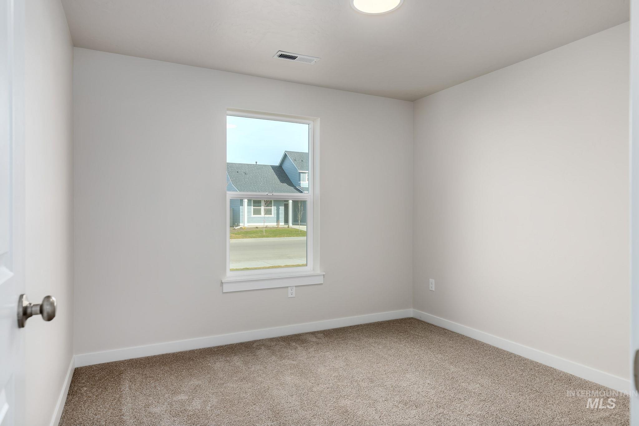 11363 Bluefield Drive Caldwell, ID 83605 - Photo 23 of 35 Spare room featuring baseboards and carpet floors