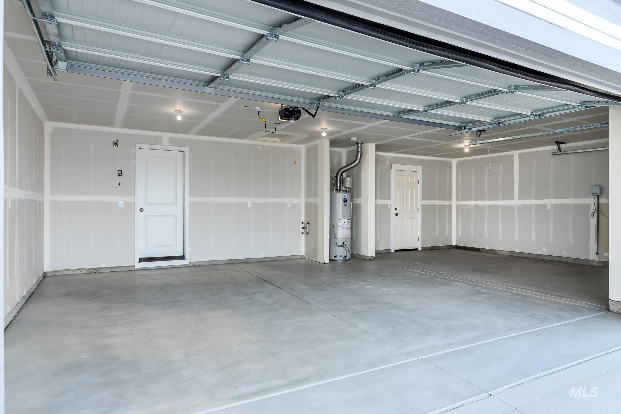 11363 Bluefield Drive Caldwell, ID 83605 - Photo 32 of 35 Garage with water heater