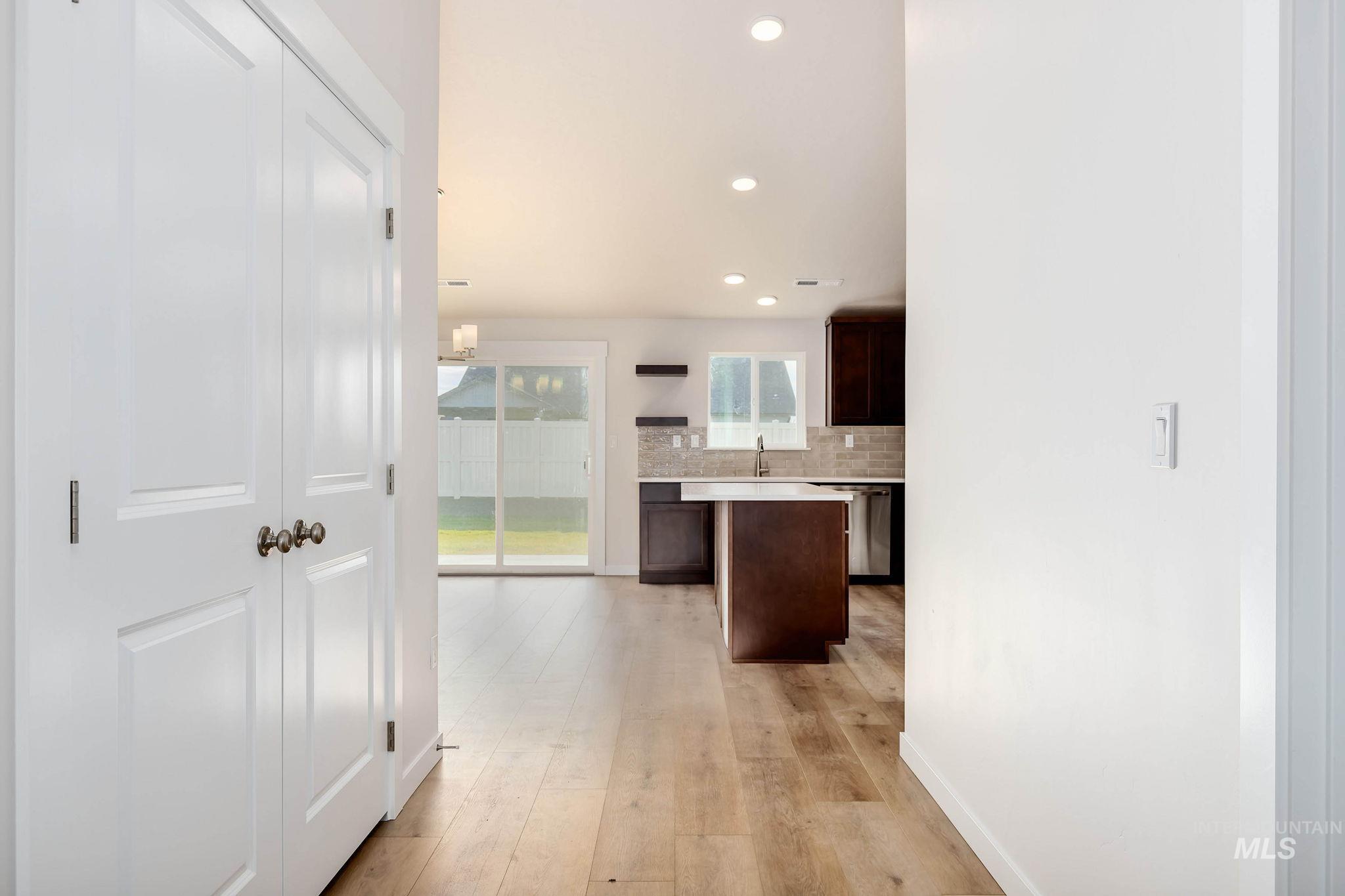 11363 Bluefield Drive Caldwell, ID 83605 - Photo 6 of 35 Hall with light wood finished floors and recessed lighting
