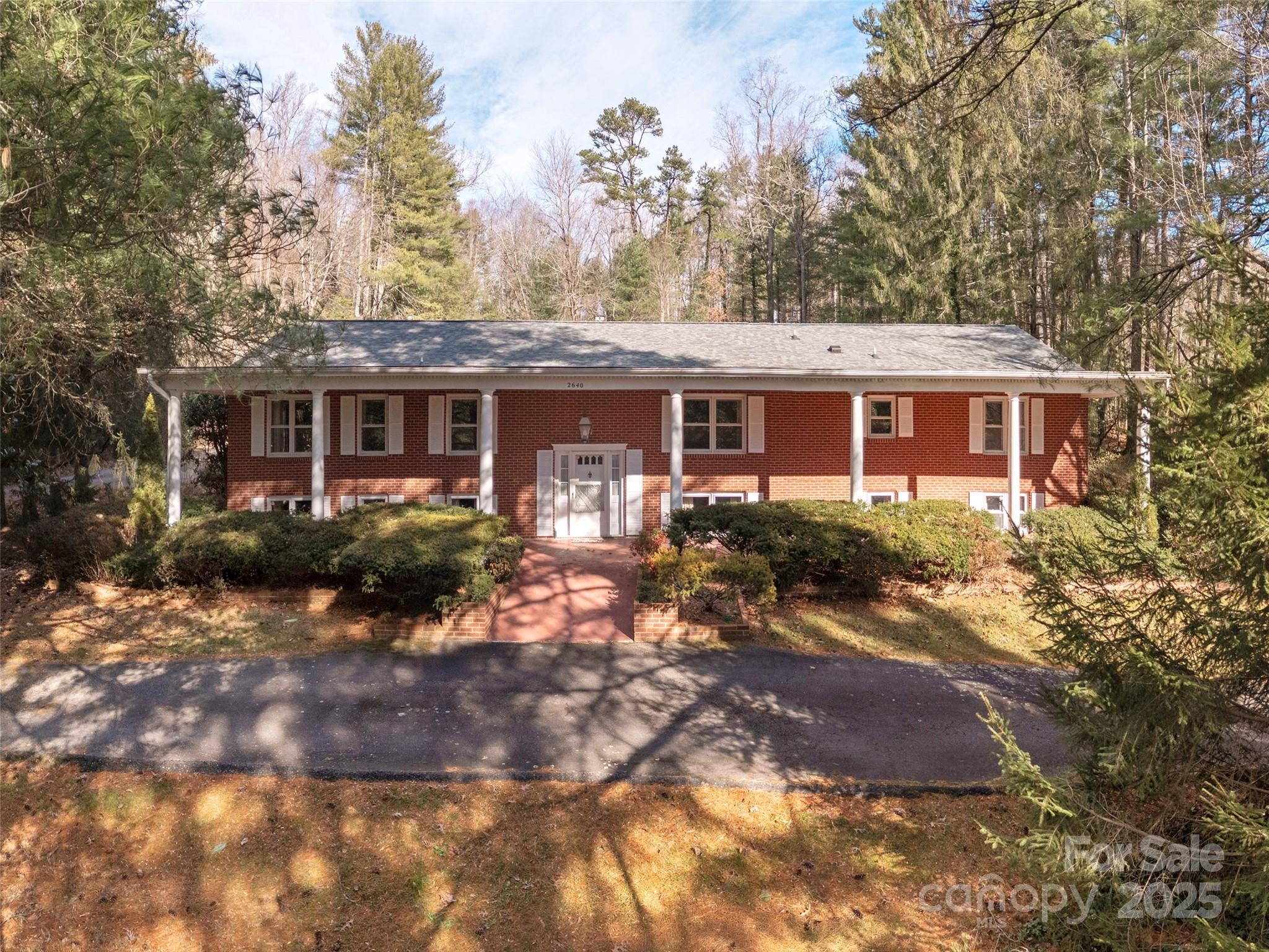 2640 Haywood Road Hendersonville, NC 28791 - Photo 1 of 41 a front view of house with yard and trees around