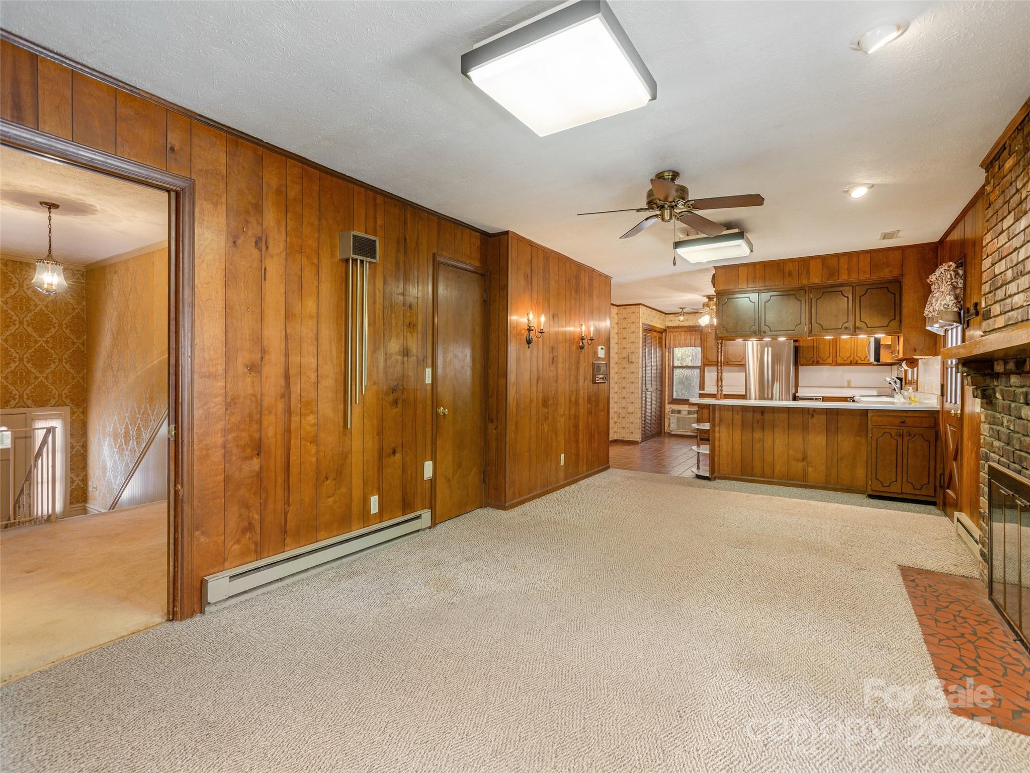 2640 Haywood Road Hendersonville, NC 28791 - Photo 14 of 41 a view of a livingroom with furniture and a kitchen view