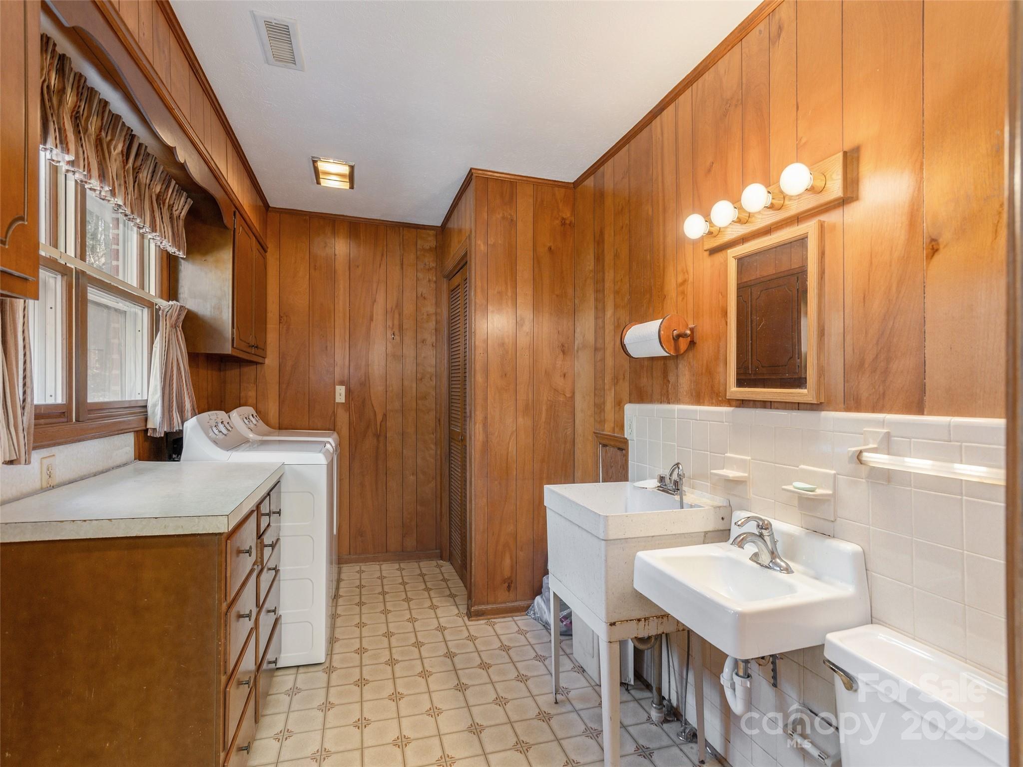 2640 Haywood Road Hendersonville, NC 28791 - Photo 15 of 41 a bathroom with a sink and a mirror