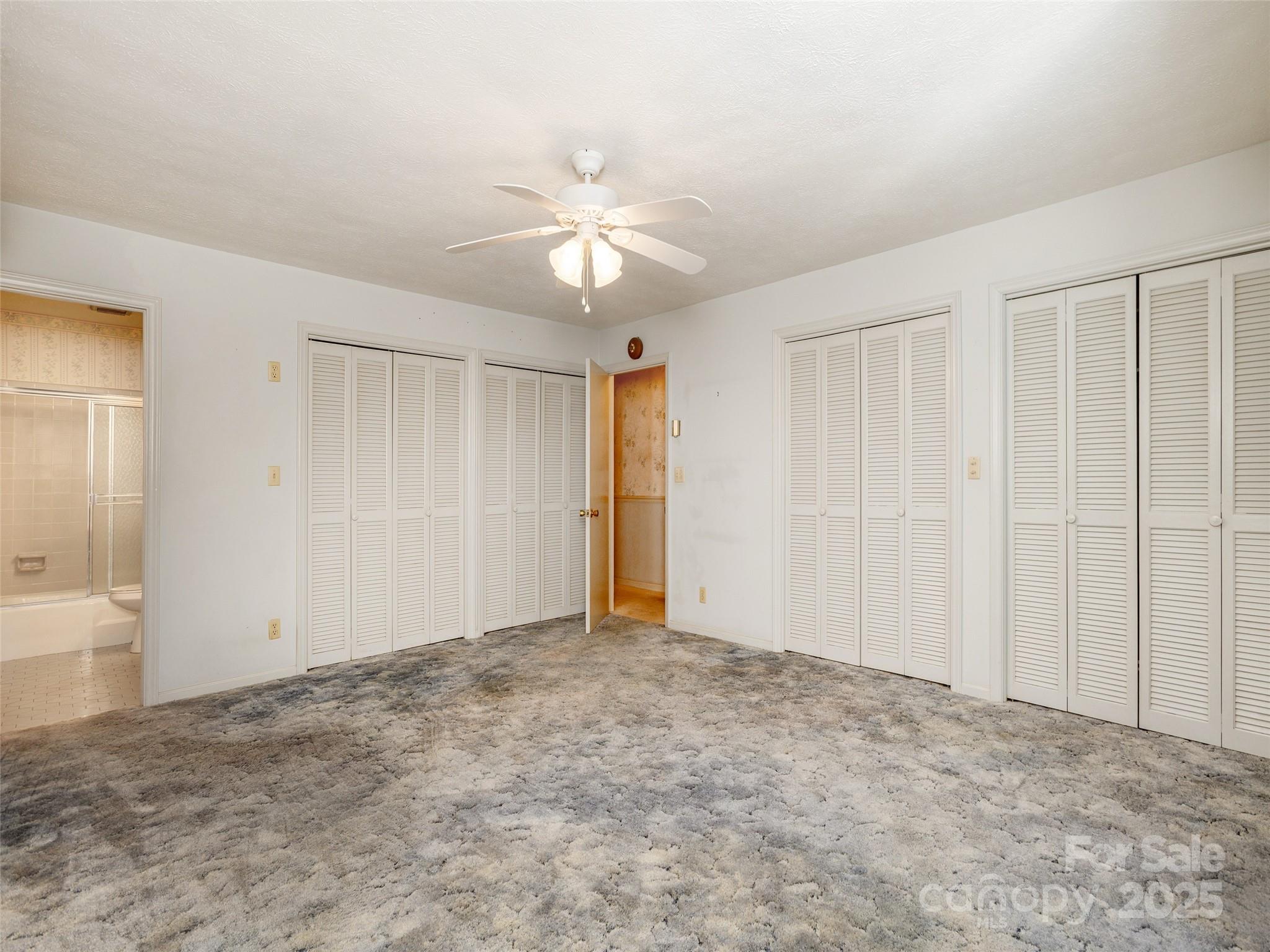 2640 Haywood Road Hendersonville, NC 28791 - Photo 20 of 41 a view of an empty room and chandelier fan