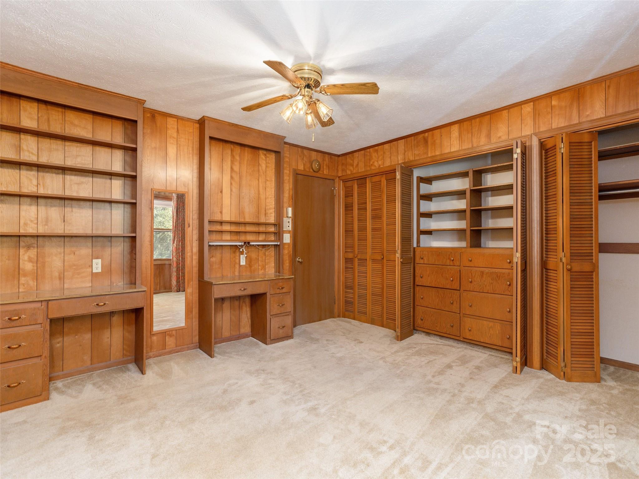 2640 Haywood Road Hendersonville, NC 28791 - Photo 23 of 41 a view of a livingroom with furniture and a ceiling fan