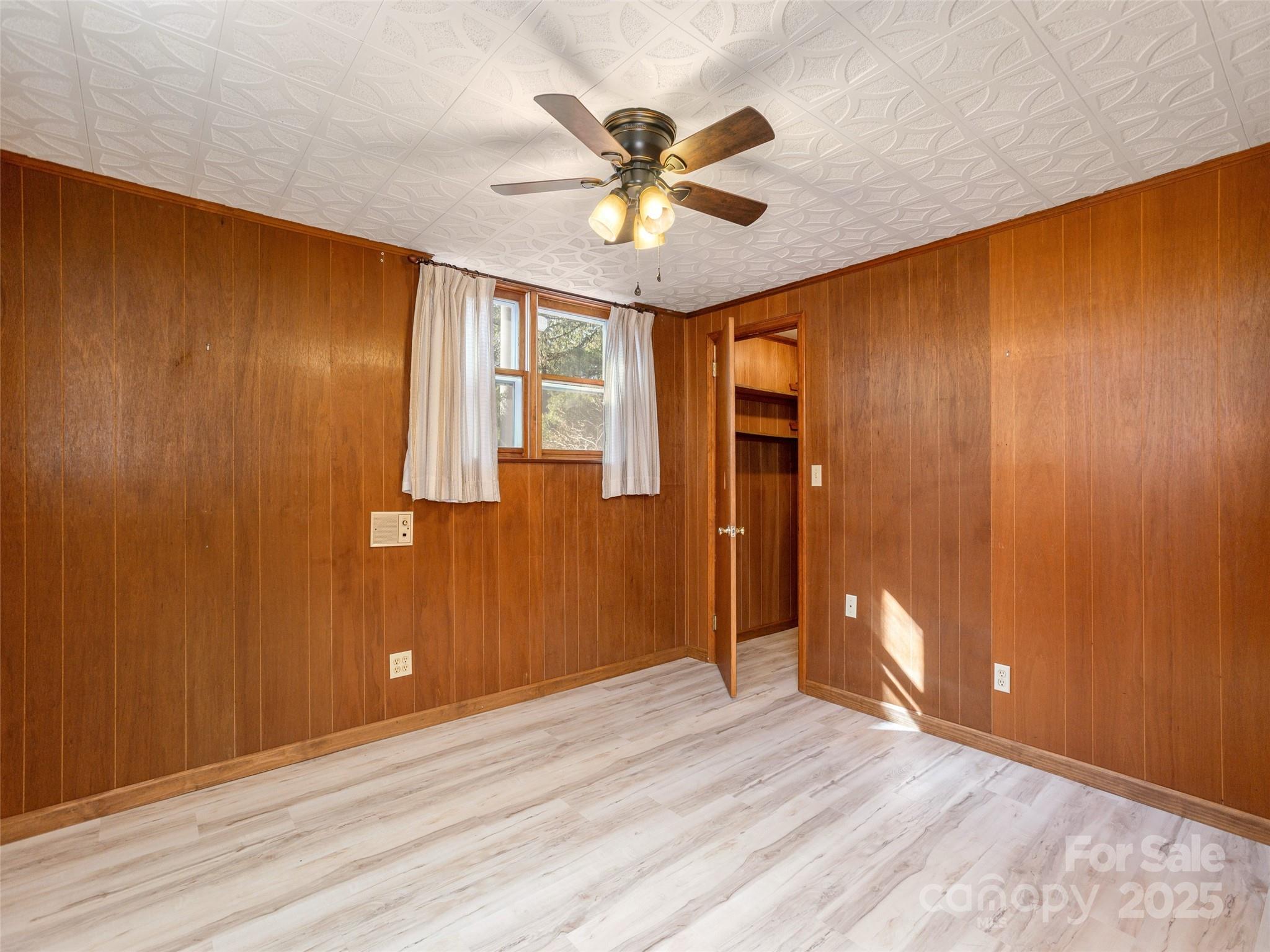 2640 Haywood Road Hendersonville, NC 28791 - Photo 31 of 41 wooden floor in an empty room with a window