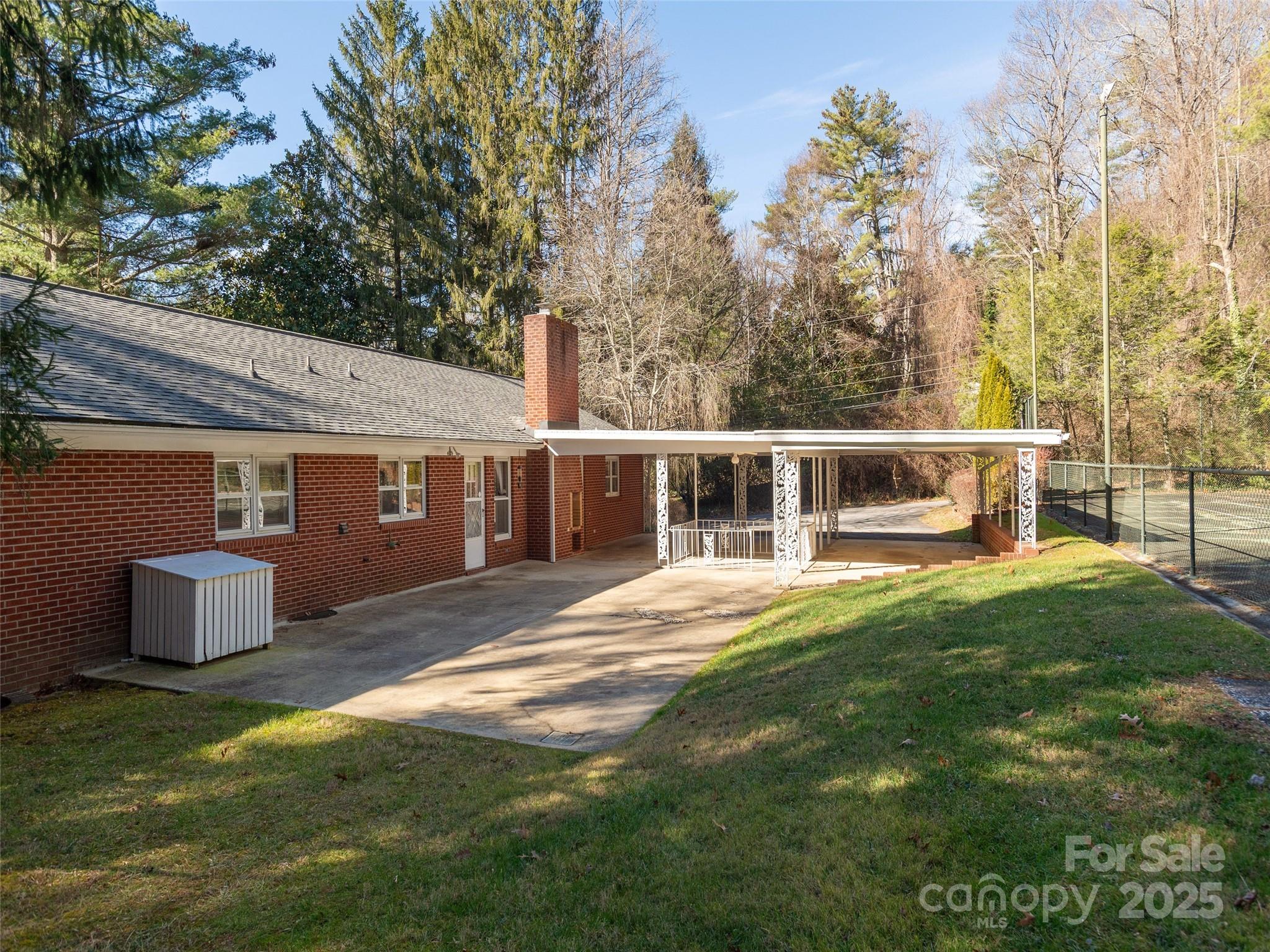 2640 Haywood Road Hendersonville, NC 28791 - Photo 35 of 41 a front view of a house with a garden
