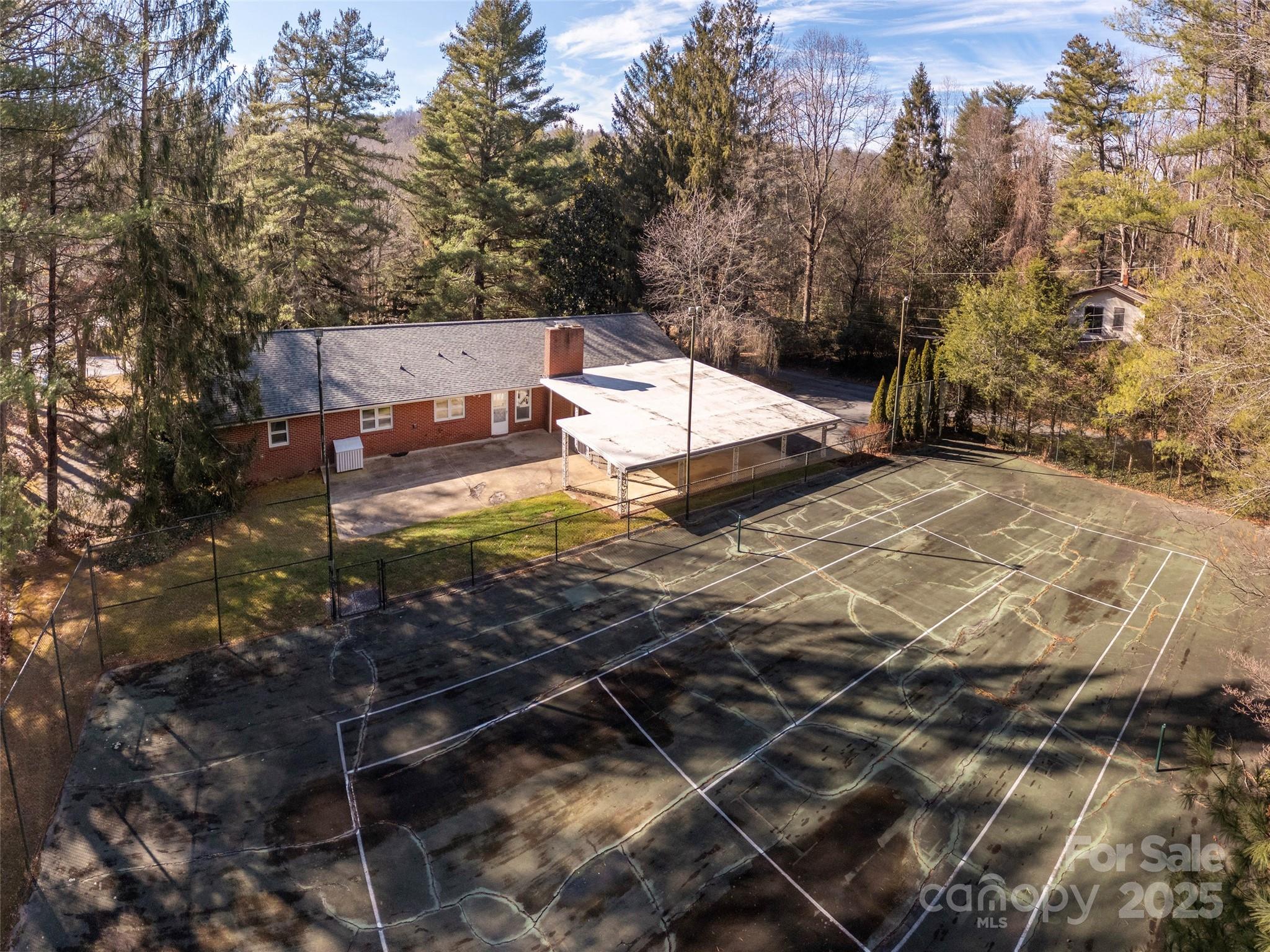 2640 Haywood Road Hendersonville, NC 28791 - Photo 39 of 41 a view of a house with a yard