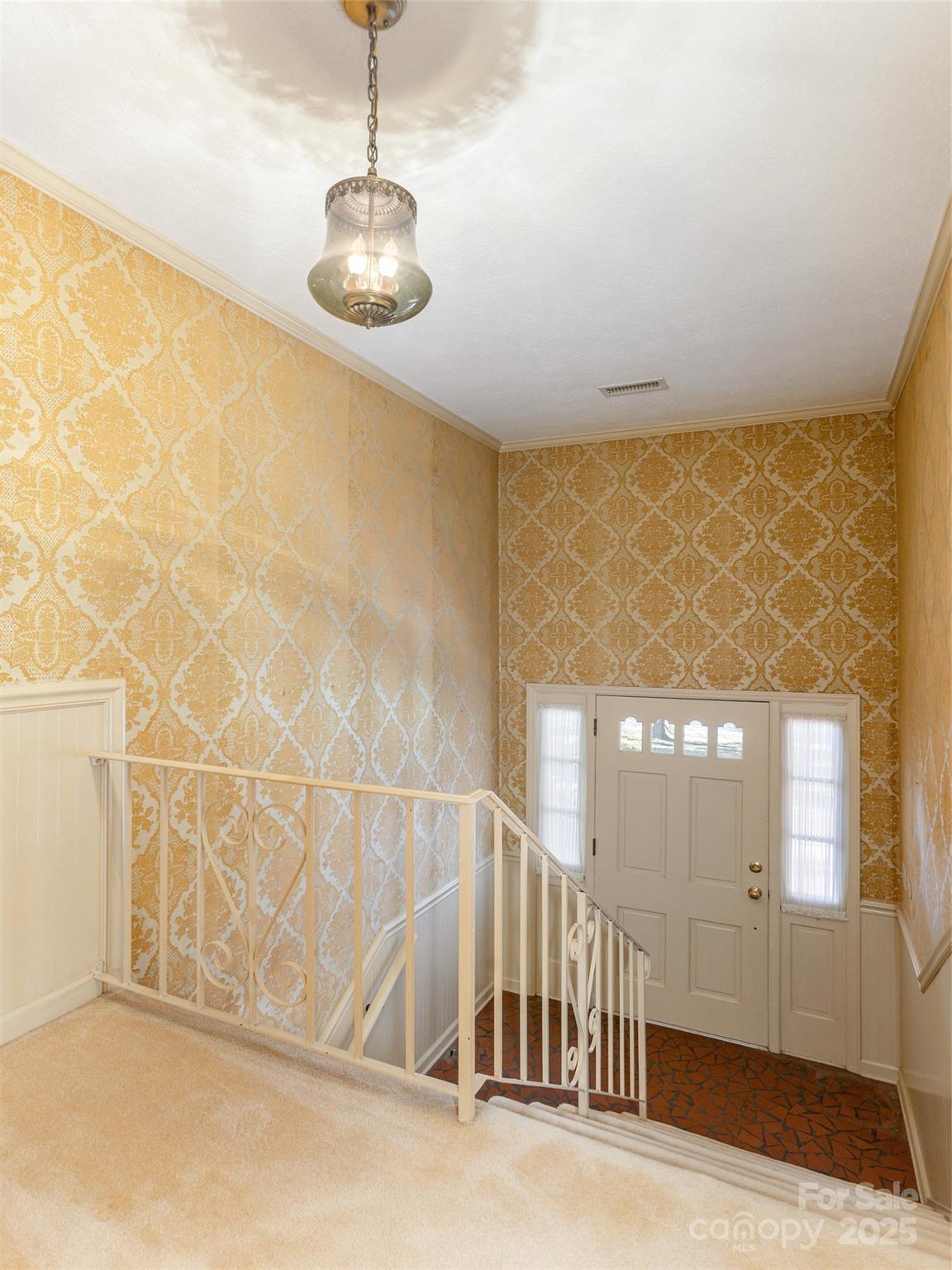 2640 Haywood Road Hendersonville, NC 28791 - Photo 5 of 41 a view of a livingroom with wooden floor and a chandelier