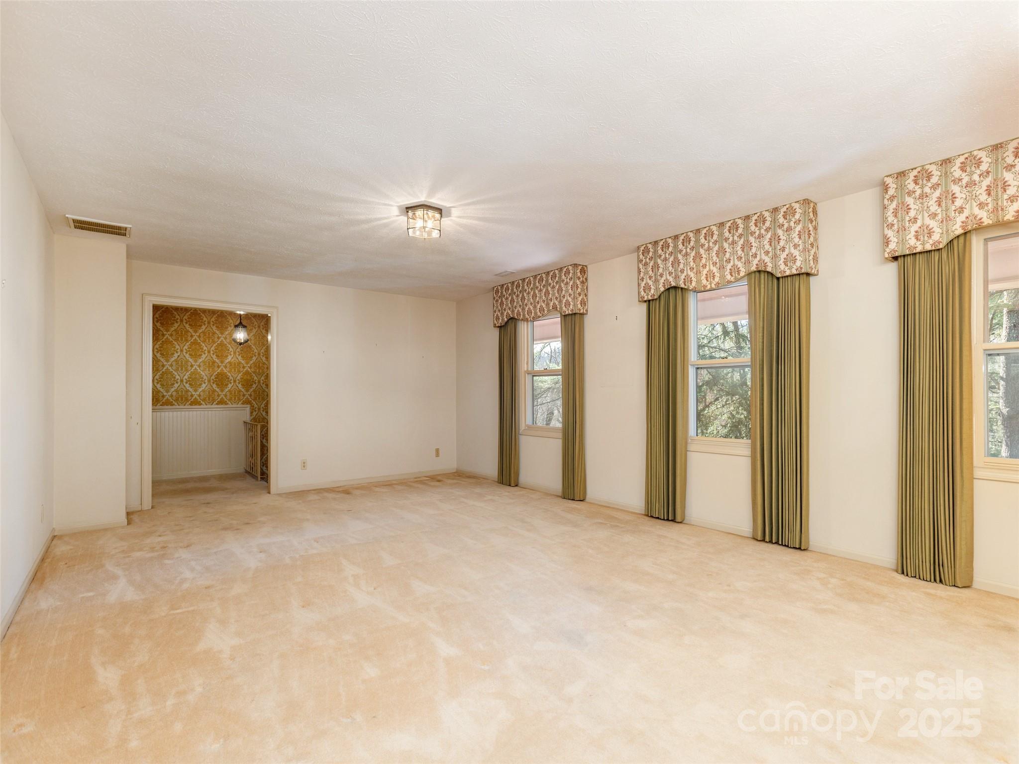 2640 Haywood Road Hendersonville, NC 28791 - Photo 6 of 41 a view of an empty room with closet and a window