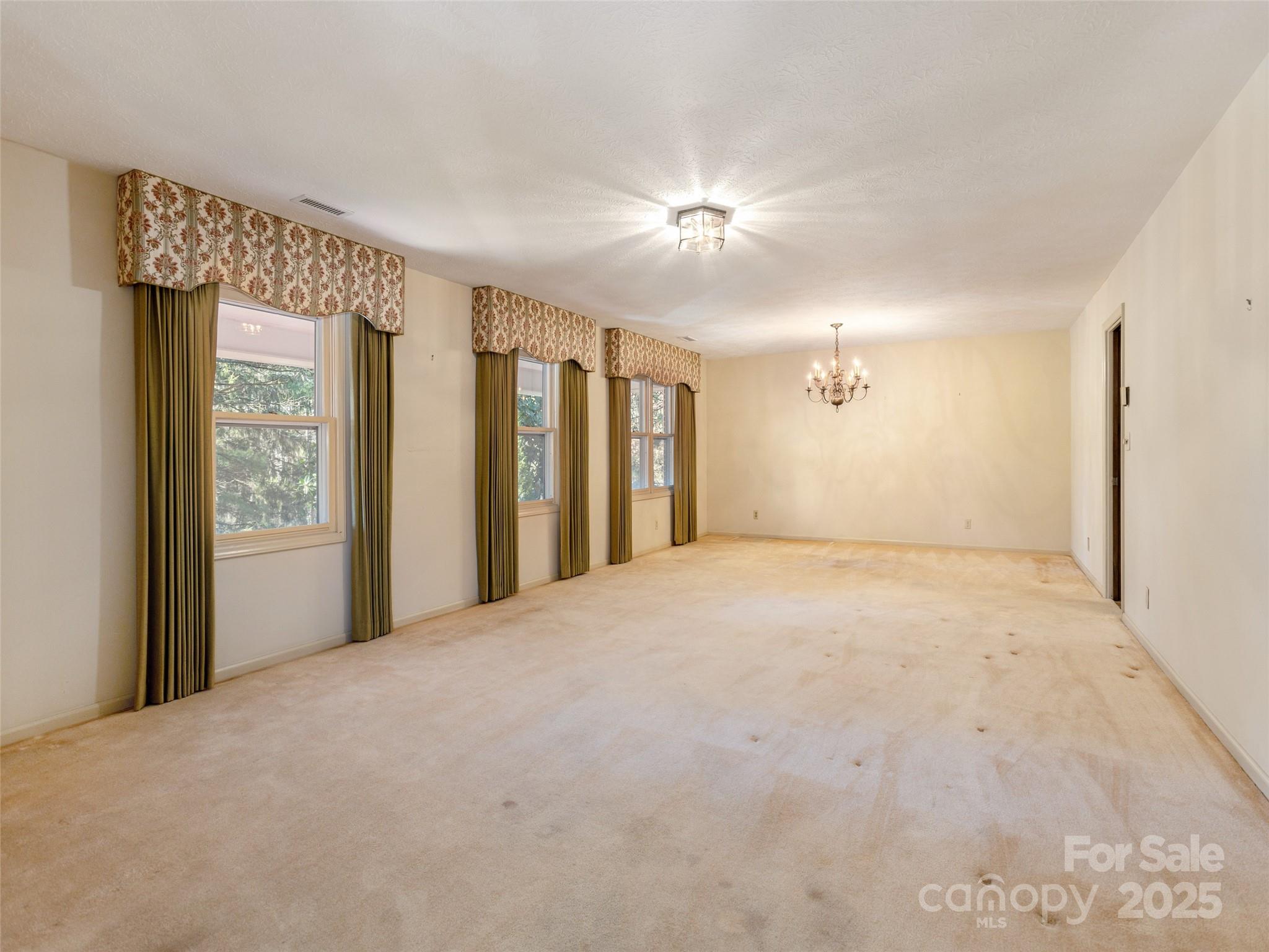 2640 Haywood Road Hendersonville, NC 28791 - Photo 7 of 41 a view of an empty room with a window