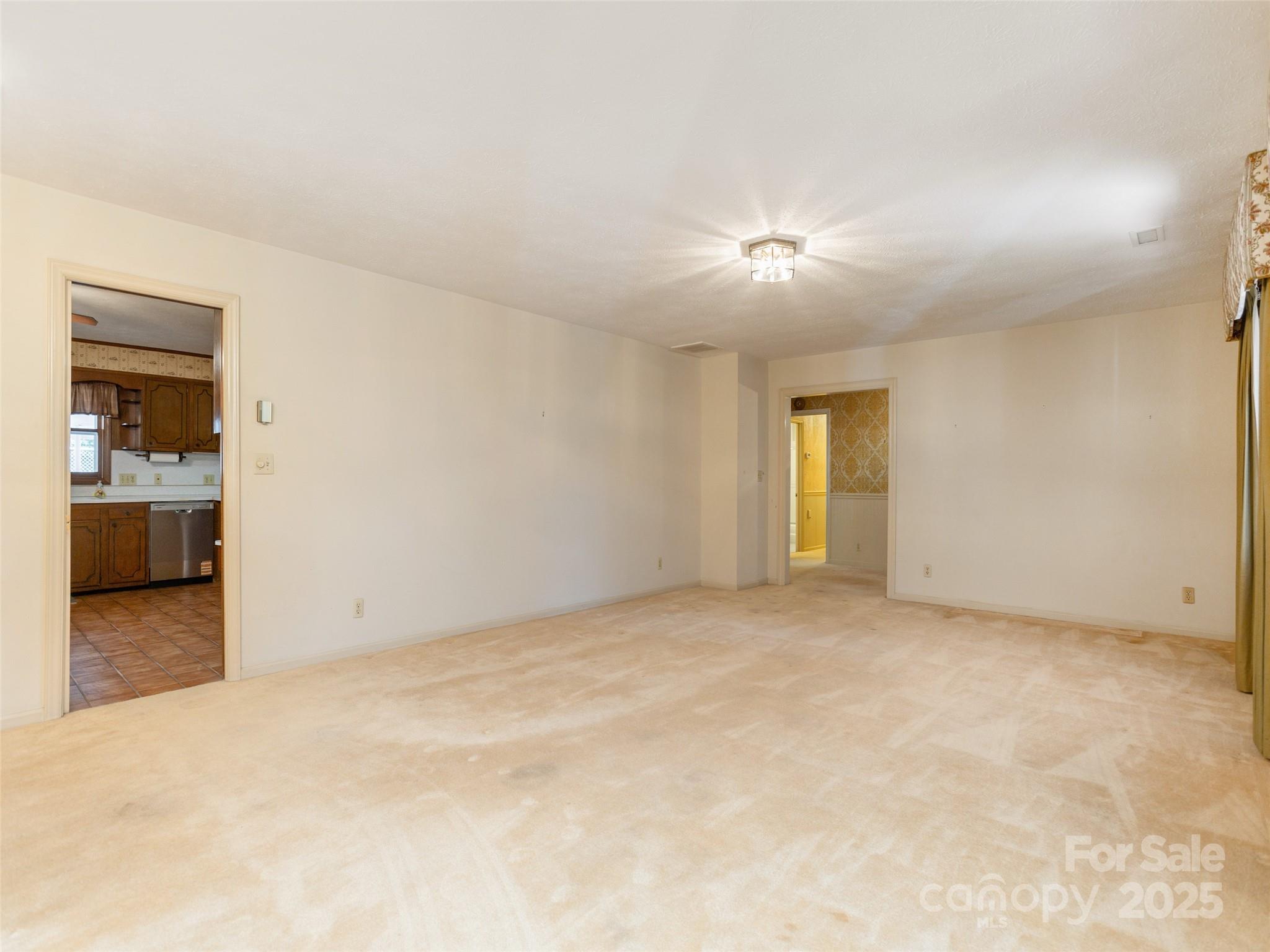 2640 Haywood Road Hendersonville, NC 28791 - Photo 8 of 41 a view of empty room with a fireplace
