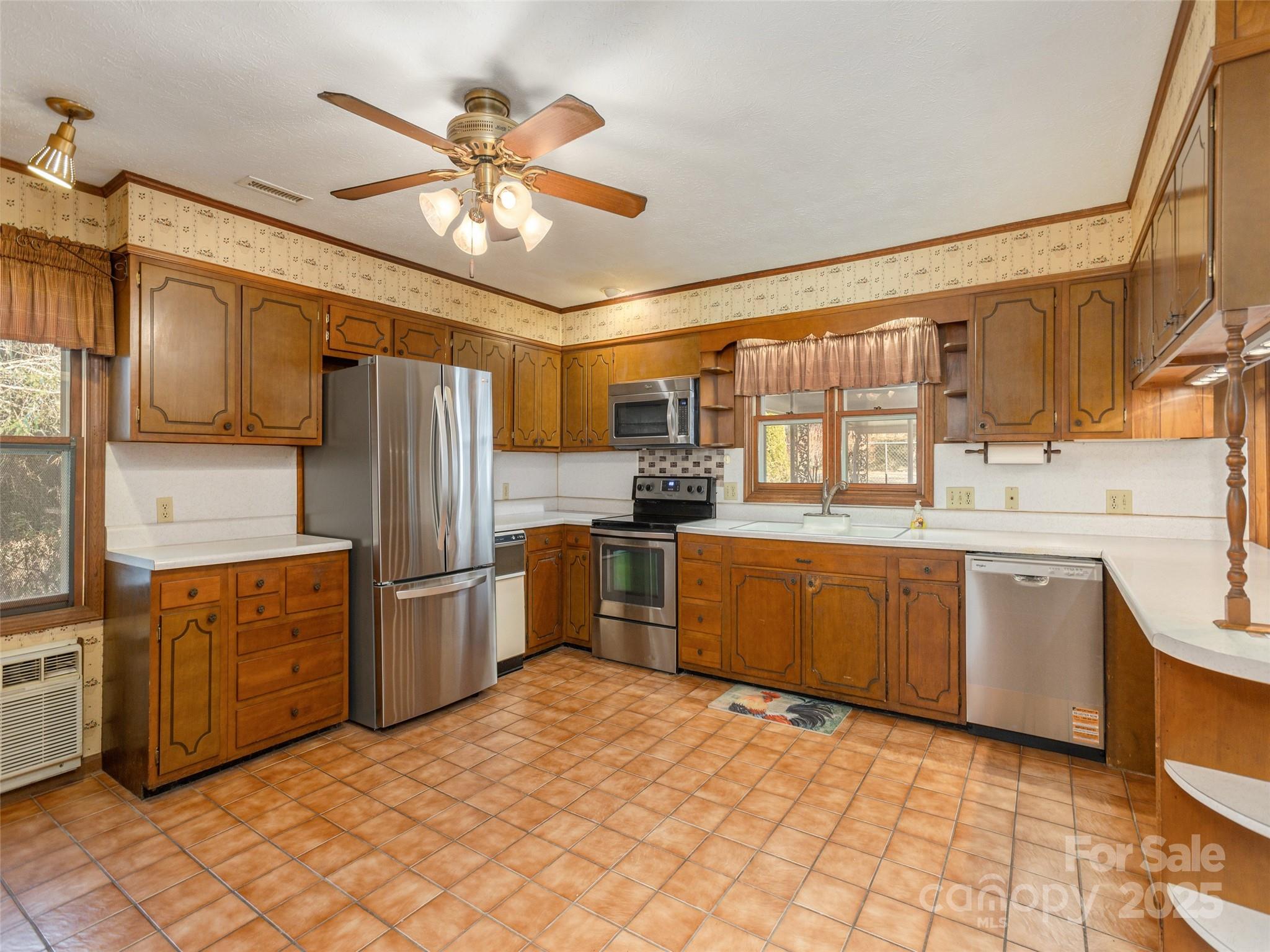 2640 Haywood Road Hendersonville, NC 28791 - Photo 9 of 41 a kitchen with granite countertop a refrigerator stove top oven and sink