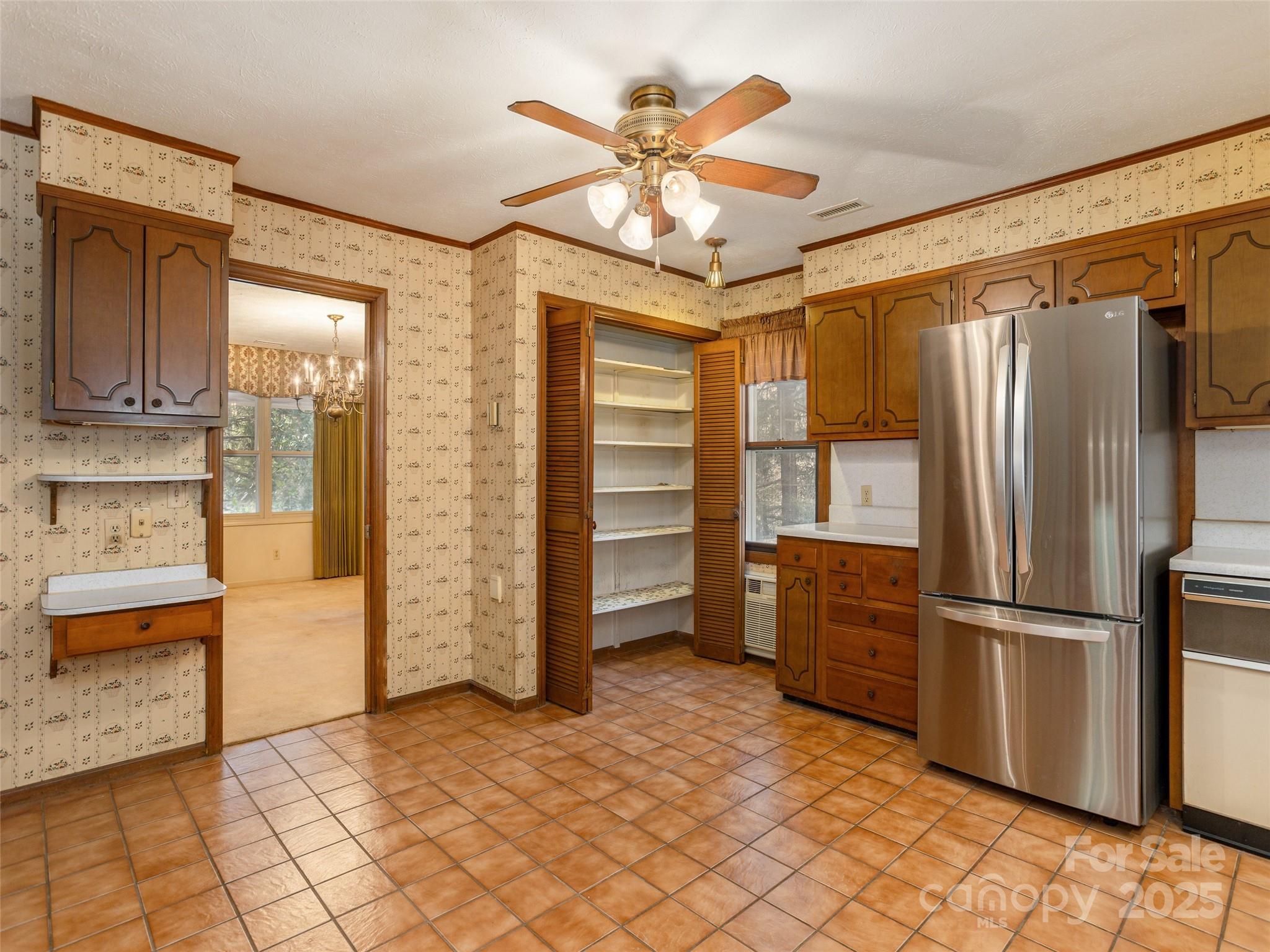 2640 Haywood Road Hendersonville, NC 28791 - Photo 10 of 41 a kitchen with stainless steel appliances kitchen island granite countertop a refrigerator and a sink