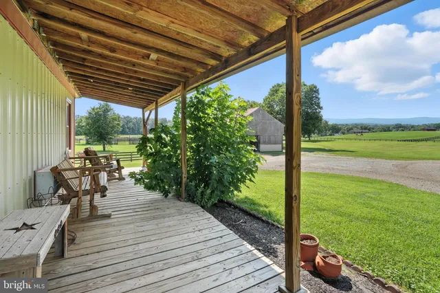 a living room with fireplace furniture and decor