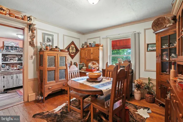 a kitchen with stainless steel appliances kitchen island granite countertop a refrigerator and a stove top oven
