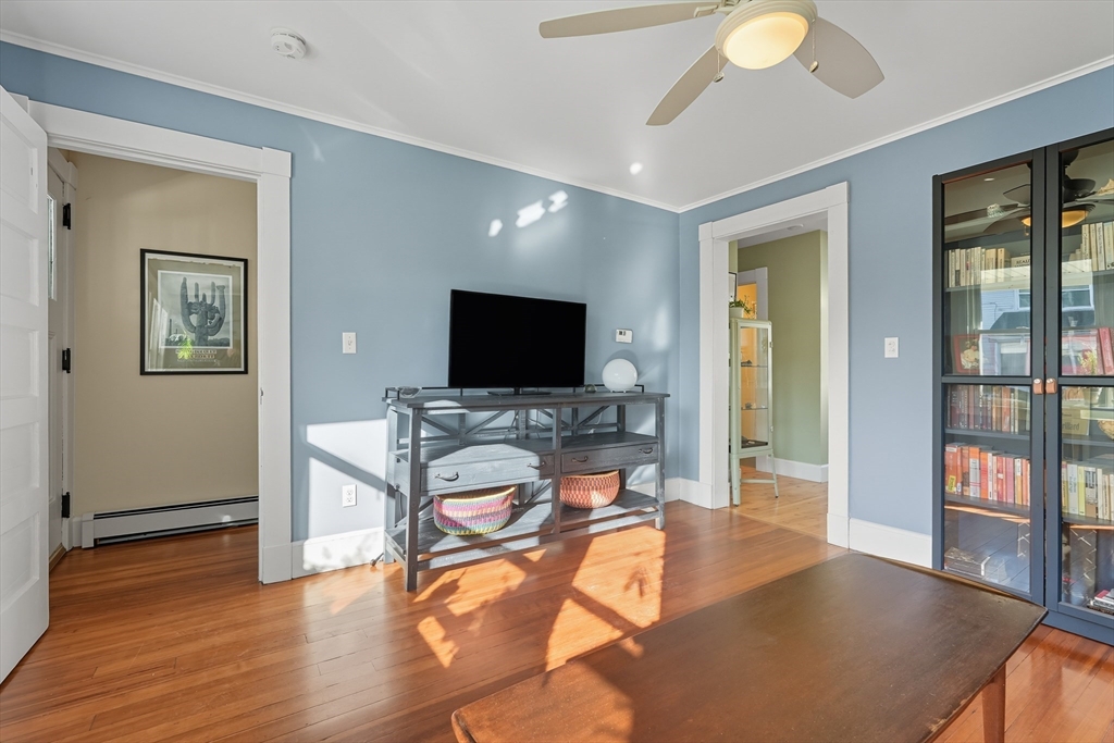 5 Grant Street, Unit 5 Easthampton, MA 01027 - Photo 11 of 36 a living room with furniture and a flat screen tv
