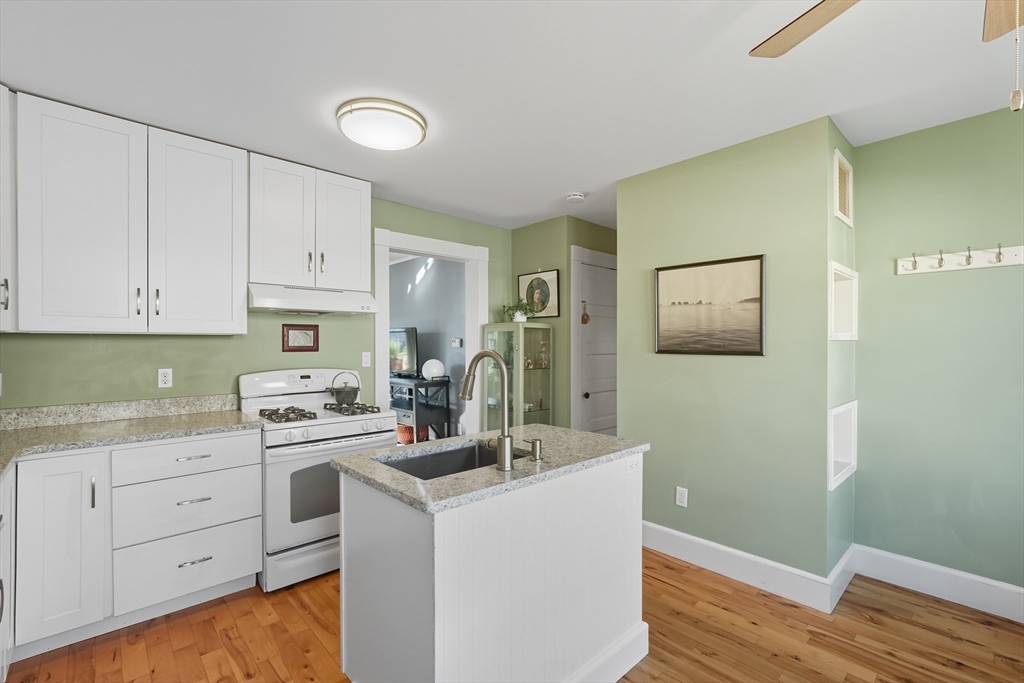 5 Grant Street, Unit 5 Easthampton, MA 01027 - Photo 13 of 36 a kitchen with a sink cabinets and wooden floor