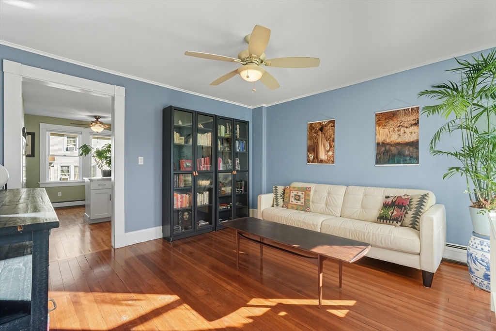 5 Grant Street, Unit 5 Easthampton, MA 01027 - Photo 2 of 36 a living room with furniture and a wooden floor