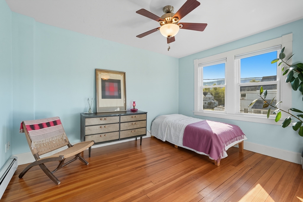 5 Grant Street, Unit 5 Easthampton, MA 01027 - Photo 22 of 36 a bedroom with a bed and a window