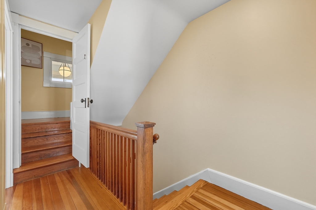 5 Grant Street, Unit 5 Easthampton, MA 01027 - Photo 25 of 36 a view of a hallway with wooden floor and entryway