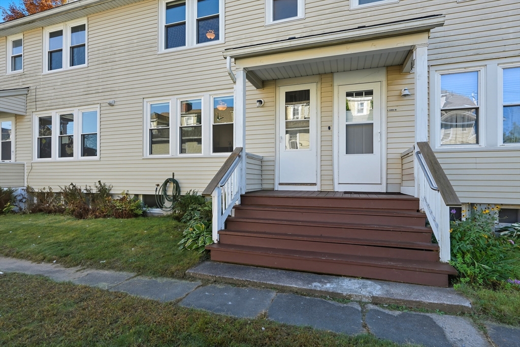 5 Grant Street, Unit 5 Easthampton, MA 01027 - Photo 30 of 36 a front view of a house with garden