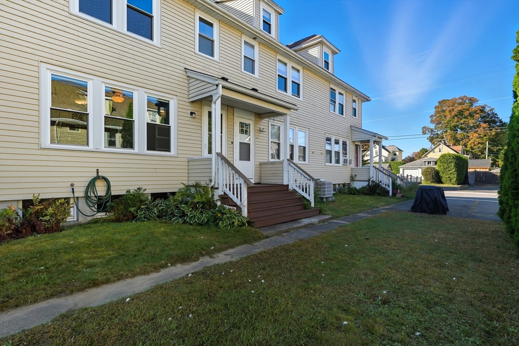 5 Grant Street, Unit 5 Easthampton, MA 01027 - Photo 31 of 36 a front view of a house with garden