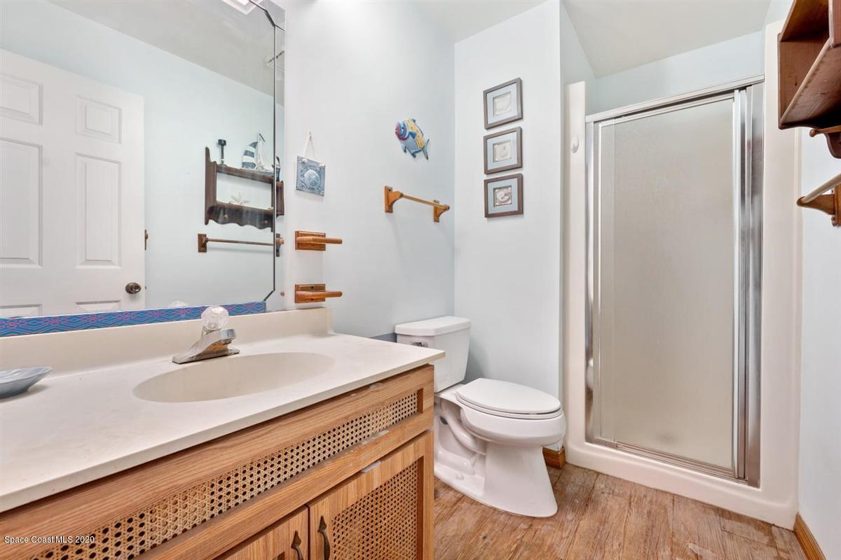 3600 Leghorn Road Grant Valkaria, FL 32950 - Photo 17 of 33 a bathroom with a sink toilet and shower