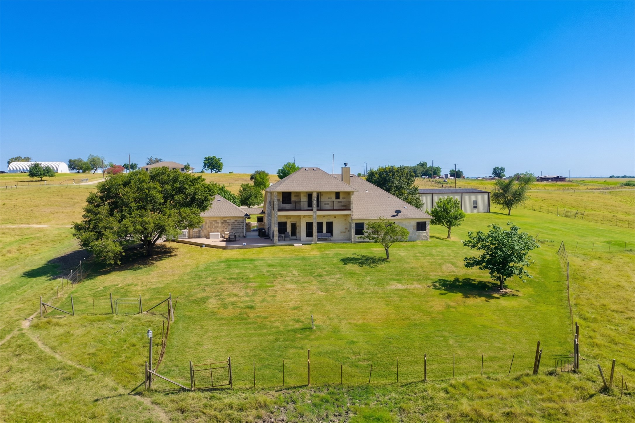 20145 Janak Road Coupland, TX 78615 - Photo 31 of 40 This magnificent stone home is nestled on an expansive, verdant acreage, offering private, picturesque rural views.