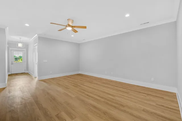 a view of house with backyard space and balcony