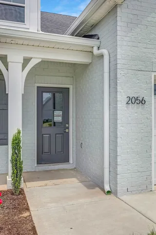 a kitchen with kitchen island a sink stainless steel appliances and cabinets