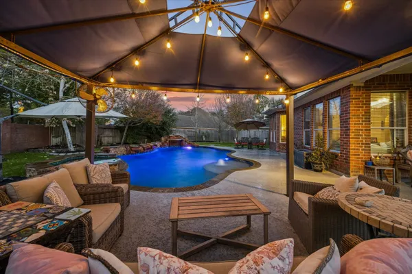 a outdoor living space with patio furniture and a potted plants
