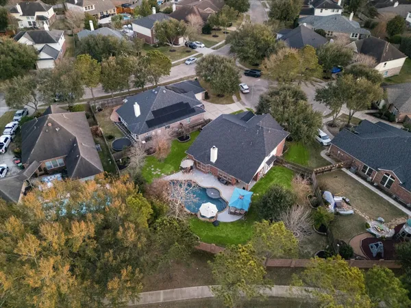 an aerial view of house with yard