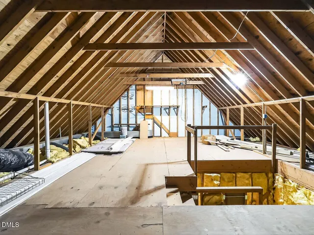 a view of a patio with table and chairs