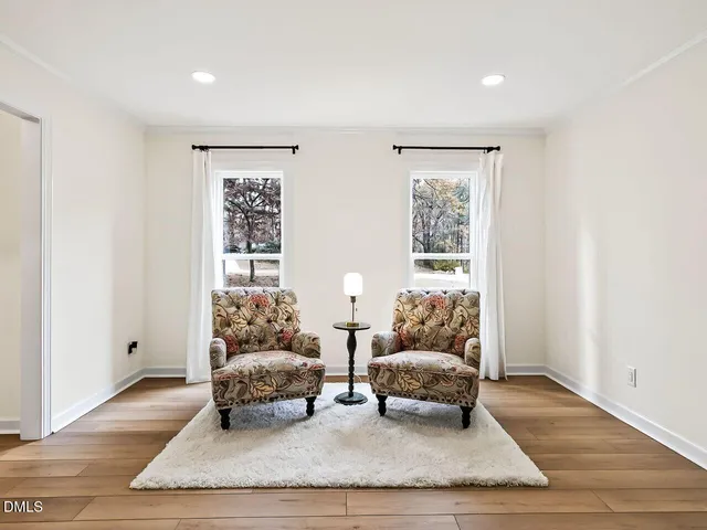 a living room with furniture and a lamp