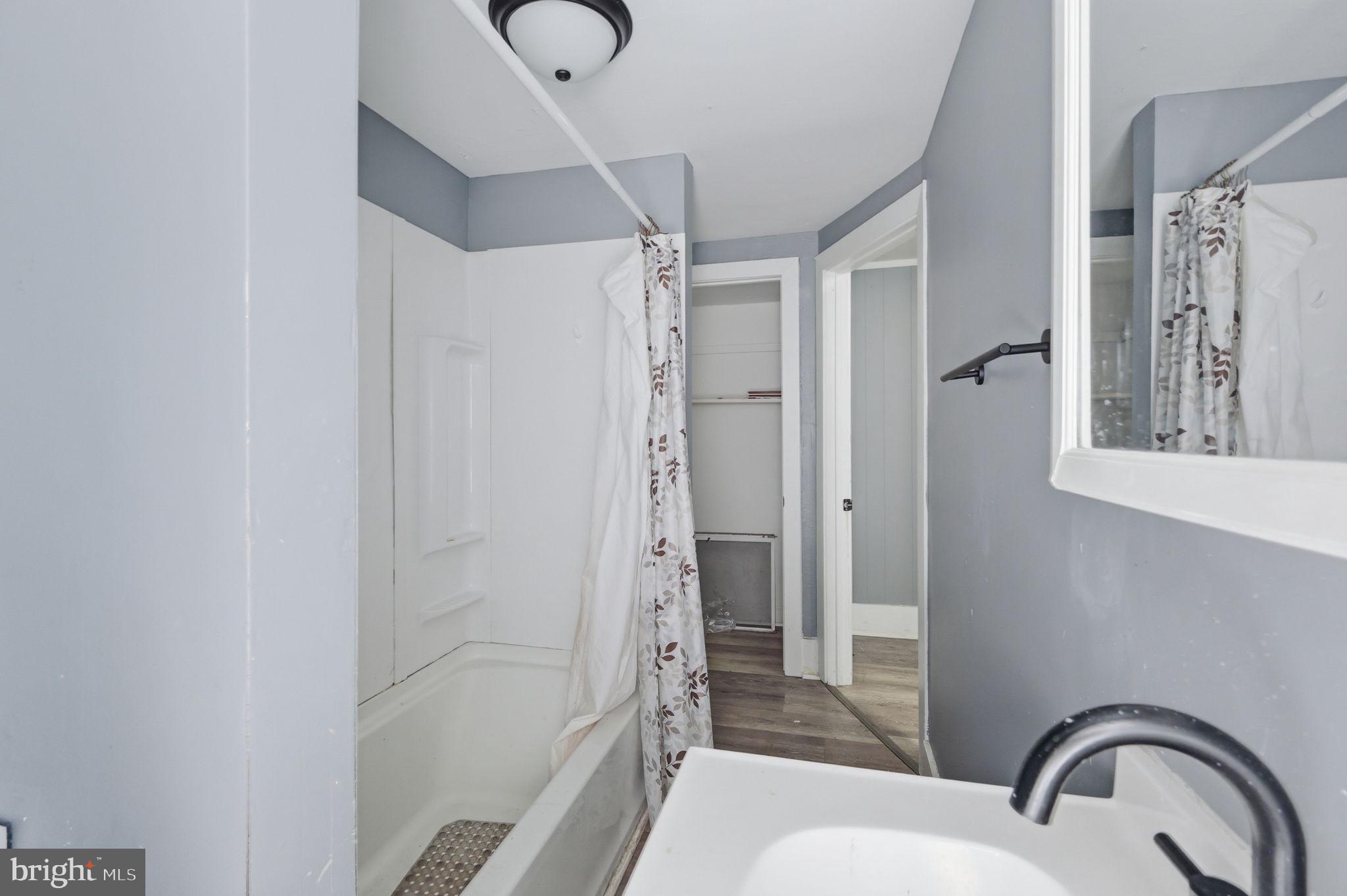 60 Walnut Street Salem, NJ 08079 - Photo 14 of 25 Modern bathroom with serene tones.