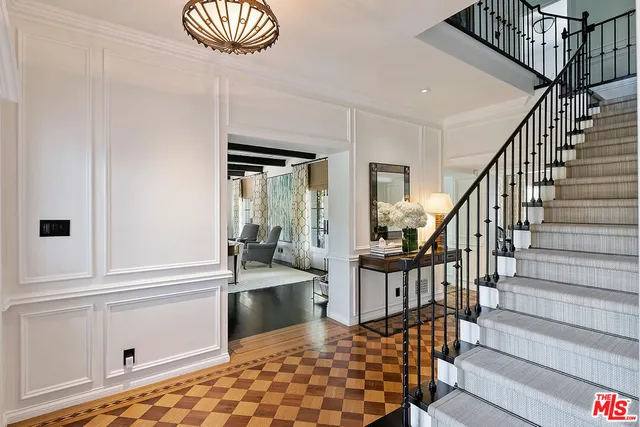 a dining room with furniture and chandelier