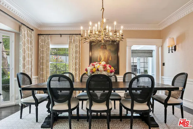 a kitchen with stainless steel appliances a stove a sink and a refrigerator
