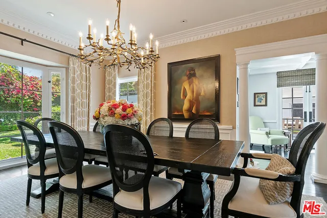 a kitchen with stainless steel appliances a stove a sink and cabinets
