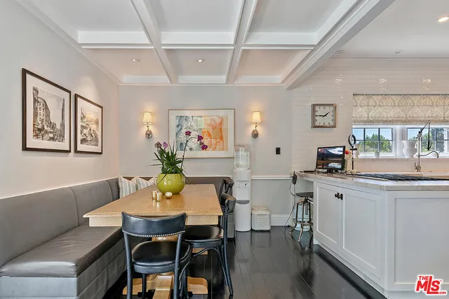 a kitchen with a stove cabinets and window