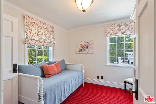 a bathroom with a bathtub and a window